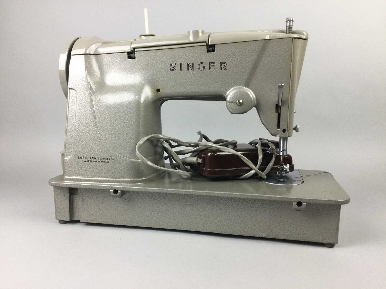 Lot 279 - A CASED SINGER SEWING MACHINE