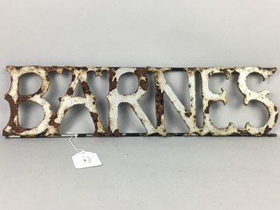 Lot 108 - A CAST AND PAINTED IRON 'BARNES' SIGN AND A WALKING STICK