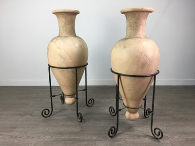 Lot 288 - A PAIR OF CERAMIC URNS ON STANDS