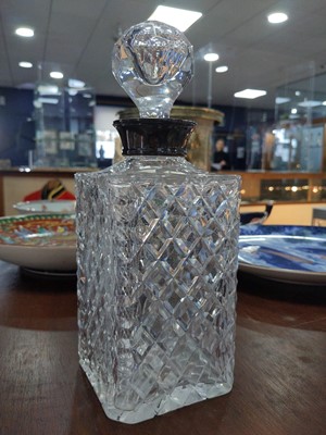 Lot 101 - A SILVER COLLARED DECANTER AND STOPPER