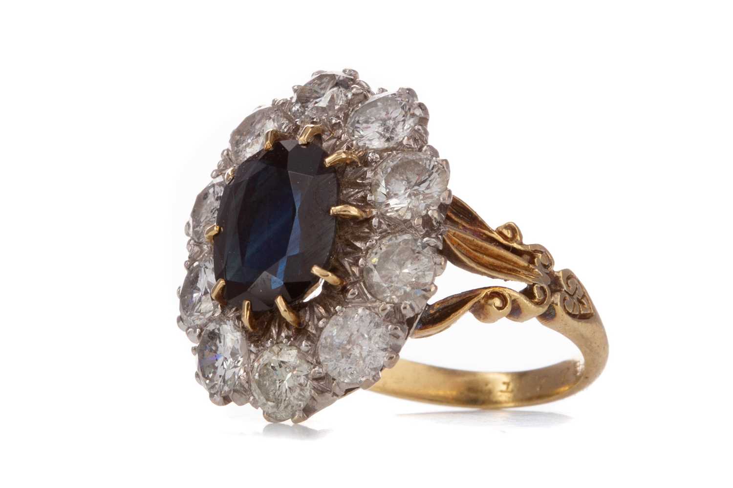 Lot 781 - AN IMPRESSIVE NATURAL SAPPHIRE AND DIAMOND CLUSTER RING
