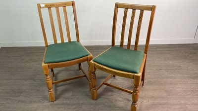 Lot 51 - A SET OF FOUR OAK RAIL BACK DINING CHAIRS