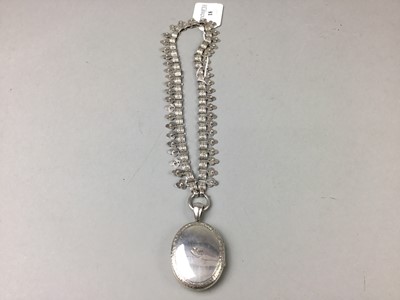 Lot 18 - A VICTORIAN STYLE SILVER LOCKET ON CHAIN