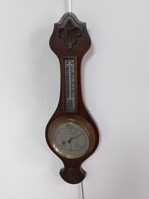 Lot 228 - A BAROMETER AND A MANTEL CLOCK