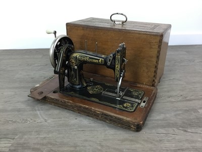 Lot 391 - A 19TH CENTURY PORTABLE SEWING MACHINE AND THREE OTHERS