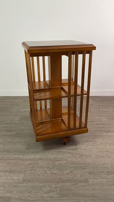 Lot 276 - A YEW WOOD REVOLVING BOOKCASE