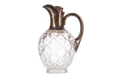 Lot 146 - A VICTORIAN SILVER MOUNTED GLASS CLARET JUG