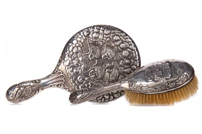 Lot 137 - A SILVER BACKED HAND-MIRROR AND HAIRBRUSH