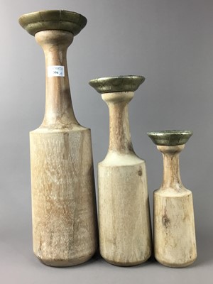 Lot 356 - A SET OF THREE GRADUATED CANDLE HOLDERS AND TWO VASES