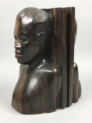 Lot 377 - A PAIR OF AFRICAN CARVED WOOD BOOKENDS AND A SMOKING COMPANION