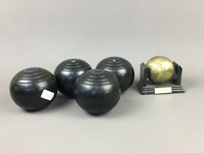 Lot 397 - A SET OF FOUR LAWN BOWLS