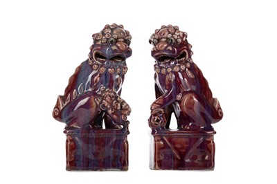 Lot 1156 - A PAIR OF CHINESE POLYCHROME FO DOGS