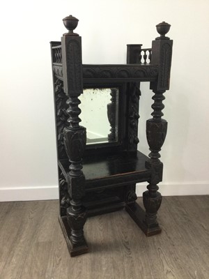 Lot 245 - A CARVED OAK TWO TIER WHATNOT