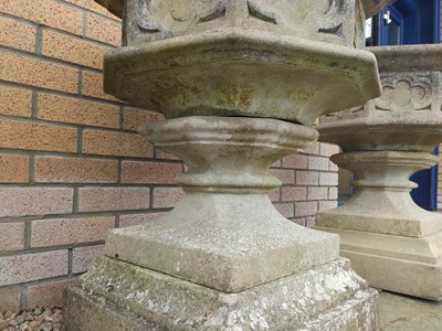 Lot 761 - A PAIR OF COMPOSITION STONE GARDEN URNS