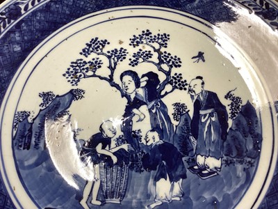 Lot 1143 - A CHINESE BLUE AND WHITE STONEWARE CIRCULAR PLAQUE