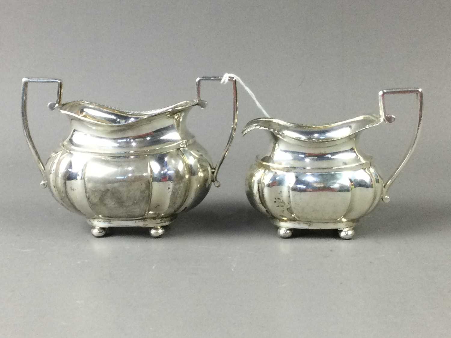 Lot 115 - A SILVER AND PARCEL GILT SUGAR AND CREAM