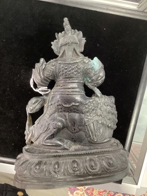 Lot 1206 - A BRONZED METAL VAISHRAVANA ‘TREASURE KING’ BUDDHA AND A BELL