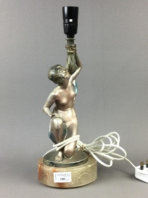 Lot 180 - A SILVERED PLASTER FIGURAL TABLE LAMP AND MIRROR