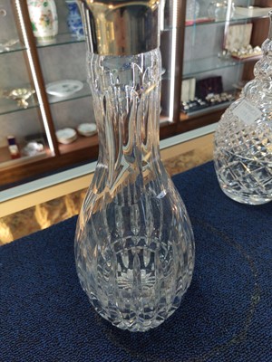 Lot 179 - THREE SILVER COLLARED CLEAR GLASS DECANTERS