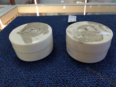 Lot 1250 - TWO JAPANESE CARVED IVORY CIRCULAR BOXES