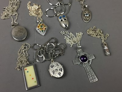 Lot 261 - A COLLECTION OF EIGHT SILVER PENDANTS ON CHAINS