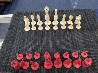 Lot 1026 - A 19TH CENTURY NATURAL AND STAINED IVORY CHESS SET