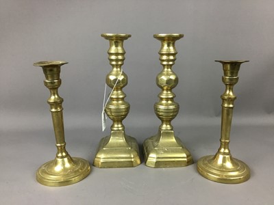 Lot 414 - TWO PAIRS OF BRASS CANDLESTICKS