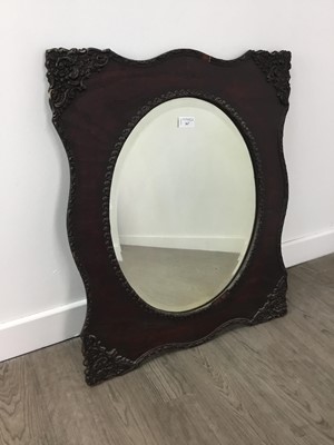 Lot 367 - AN OAK OVAL WALL MIRROR AND A BRASS WALL MIRROR