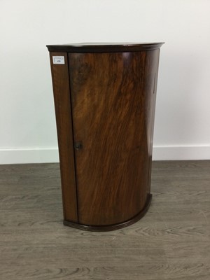 Lot 428 - A WALNUT BOW FRONTED CORNER CUPBOARD