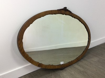 Lot 430 - A MAHOGANY OVAL WALL MIRROR