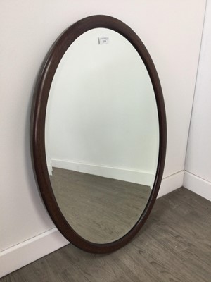 Lot 275 - AN OVAL BEVELLED WALL MIRROR