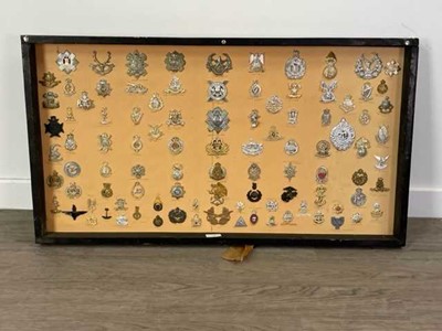 Lot 26 - A DISPLAY OF MILITARY CAP AND LAPEL BADGES