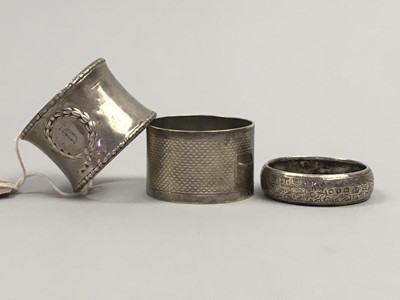 Lot 365 - A SILVER NAPKIN RING AND TWO OTHER TWO NAPKIN RINGS