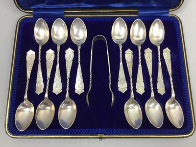 Lot 431 - A CASED SET OF TWELVE SILVER TEA SPOONS AND SUGAR TONGS