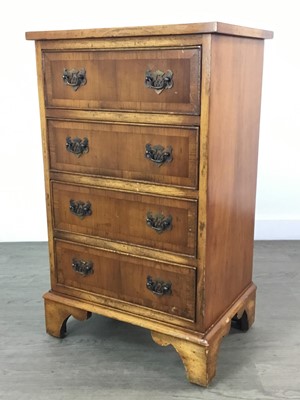 Lot 145 - A REPRODUCTION WALNUT FOUR DRAWER CHEST