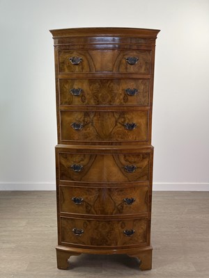 Lot 190 - A REPRODUCTION WALNUT BOWFRONTED TALLBOY CHEST