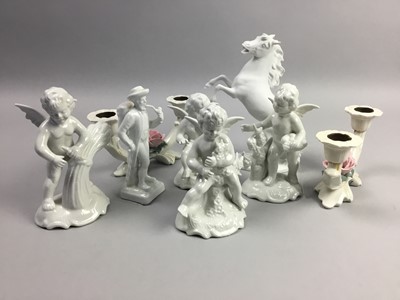 Lot 205 - A SET OF FOUR GERMAN BLANC DE CHINE TYPE CHERUB FIGURES AND OTHER CERAMICS