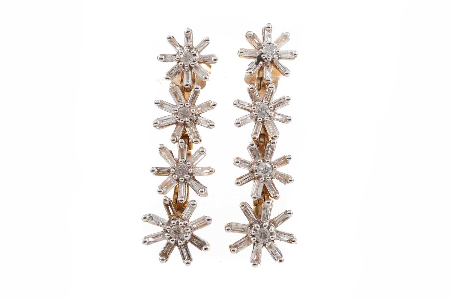 Lot 1147 - A PAIR OF DIAMOND DROP FLOWER EARRINGS
