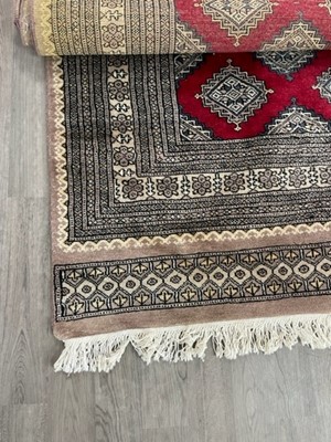 Lot 306 - A TURKISH RUG