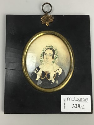 Lot 329 - A PAIR OF PORTRAIT MINIATURES OF A LADY