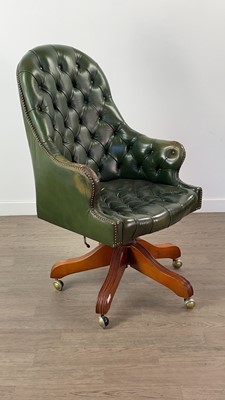 Lot 396 - A GREEN LEATHER SWIVEL ARMCHAIR