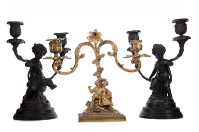 Lot 701 - A PAIR OF PATINATED METAL TWIN BRANCH CANDELABRA