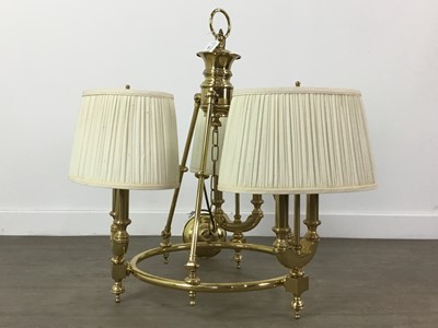 Lot 409 - A BRASS CHANDELIER