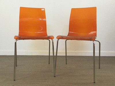 Lot 359 - A SET OF SIX ORANGE PERSPEX AND CHROME STACKING CHAIRS