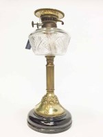 Lot 1022 - LATE 19TH CENTURY BRASS AND GLASS OIL LAMP...