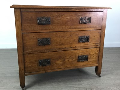 Lot 689 - AN ARTS & CRAFTS OAK CHEST OF THREE DRAWERS