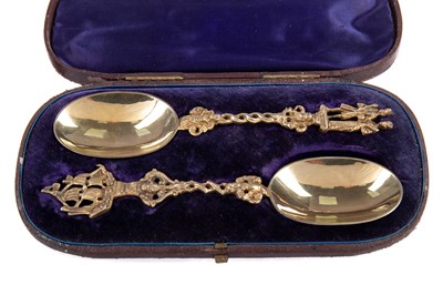 Lot 77 - A PAIR OF VICTORIAN SILVER GILT MARRIAGE SPOONS