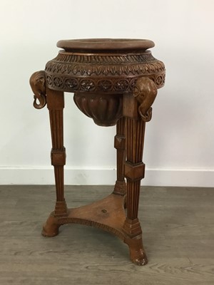 Lot 720 - A CARVED AND STAINED WOOD JARDINIERE STAND