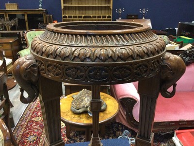 Lot 720 - A CARVED AND STAINED WOOD JARDINIERE STAND