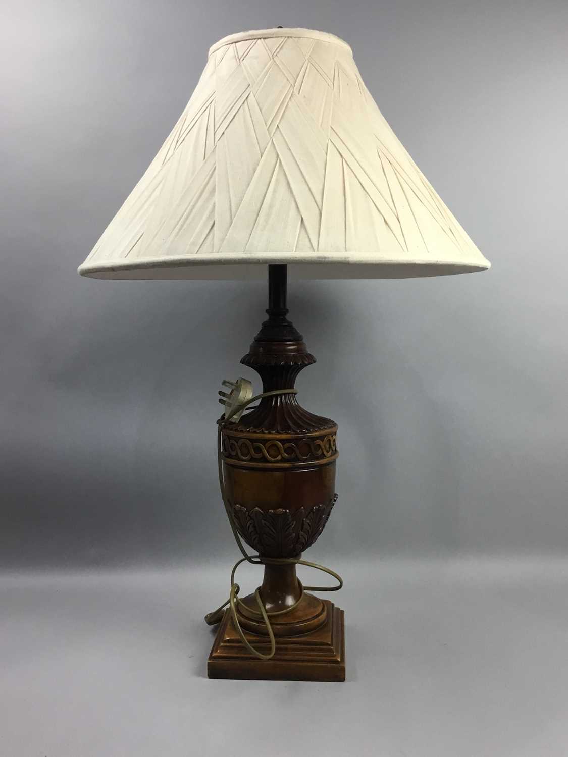 Lot 710 - A REPRODUCTION CARVED WALNUT TABLE LAMP